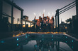 © oneinchpunch - Group of friends having fun on the rooftop of a beautiful penthouse