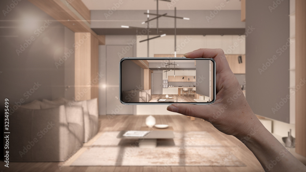 Hand holding smart phone, AR application, simulate furniture and ...