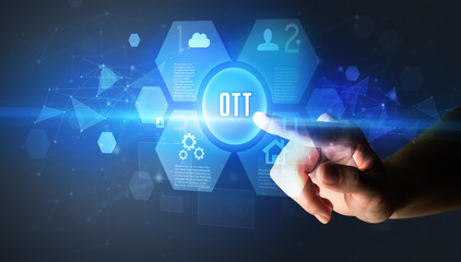 Hand touching OTT inscription, new technology concept