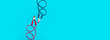 battery jumper cables on light blue background, red and black are parallel to each other, panoramic mock-up with place for text