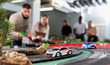 © JackF - Slot car racing track. Emotional players drive toy cars