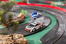 Electric Slot Cars On The Toy Race Track