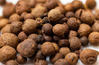 © Sergey - Allspice peas on a white background.