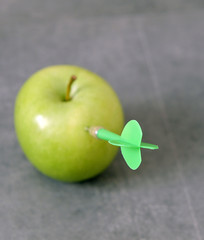 Wall Mural - green apple and dart, to be committed to losing weight,