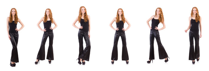 Wall Mural - Redhead woman in black bell bottom pants on white