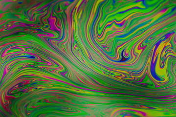 Psychedelic abstract background. Photo macro shot with light interference on the surface of a soap bubble