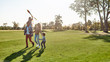 © Svitlana - The first happiness of a child to know that he is loved. Happy family playing a kite. Outdoor family weekend