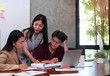 © Watcharin - Young business people working ,with colleagues team meeting,busy time,at office