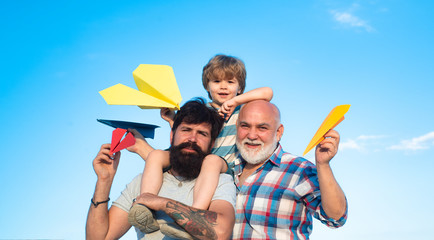 Wall Mural - Men generations. Father and son with grandfather - happy loving family