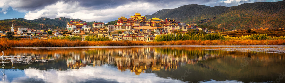 Panorama scene of Songzanlin Temple, is Tibetan Buddhist monastery in Zhongdian city, Shangri-La, Yunnan province, China, travel and tourists,famous place and landmark,religious and holiday concept - obrazy, fototapety, plakaty 