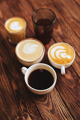 Wall Mural - five cups of coffee on vintage wood. Top view , cup on wooden table. View from top