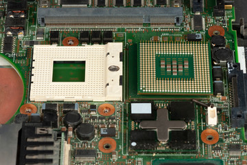 Close up of  laptop processor  with empty socket base for CPU on main board of notebook