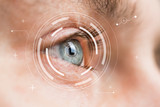 Fototapeta  - Eye monitoring and treatment in medical. Biometric scan of male eye closeup.