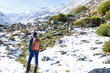 © photointruder - mountaineer woman walking in snowy mountain