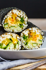 Canvas Print - Vegan nori wraps with rice, hummus, vegetables and seedlings.