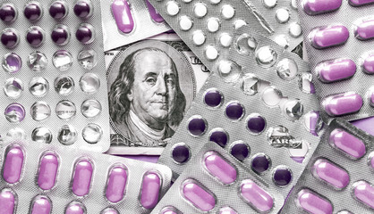 Wall Mural - Benjamin Franklin's head with dollar bills looks among blisters with purple pills, medicine flat lay