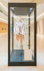 Wall Mural - Fashion women's clothes in shopping mall windows