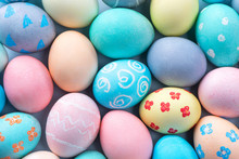 Colorful Easter Eggs Dyed By Colored Water With Beautiful Pattern On A Pale Blue Background, Design Concept Of Holiday Activity, Top View, Full Frame.