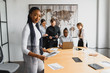 © Serhii - beautiful young african american businesswoman in office