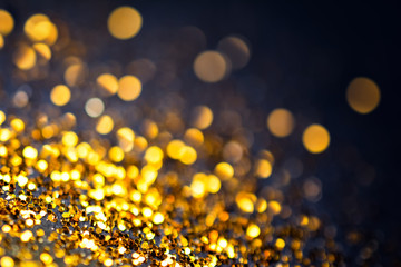 Wall Mural - Abstract golden with black background with bokeh effect