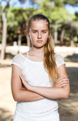 Wall Mural - Portrait of  teenage positive girl in green park at summer day