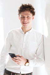 Poster - Portrait of a successful young attractive curly haired businessman