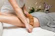 © BGStock72 - Maderotherapy anti-cellulite massage with wooden roller massager