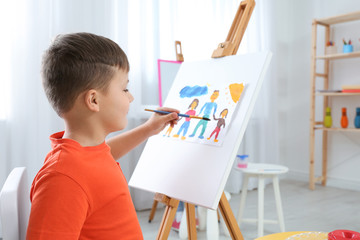 Poster - Cute little child painting during lesson in room