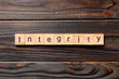 integrity word written on wood block. integrity text on table, concept