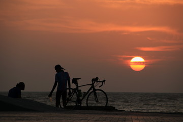 Wall Mural - silhouette of cyclist at sunrise