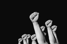 Hands And Fist Raised In The Air . The Concept Of The Struggle And The Retention Of Their Rights And Freedoms