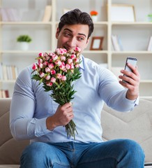 The young man chatting with his sweetheart over mobile phone