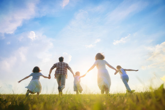 Happy family on summer walk