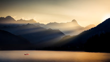 A Canoeist Crosses The Barcis Lake At Sunset, Dolomiti Friulane Natural Park, Dolomites, Friuli Venezia Giulia, Italy, Europe