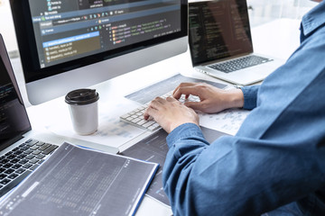 Developer programmer working on project in software development computer in IT company office, Writing codes and data code website and coding database technologies to find solution to problem
