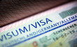 Visa stamp in passport close-up. German visitor visa at border control. Document for multiple entry. Macro view of Schengen visa for tourism and travel in EU.