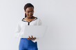 © anatoliycherkas - An isolated shot of a black businesswoman holding a laptop