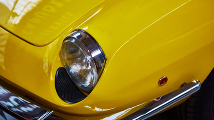 Detail of classic car. Close-up of headlight.