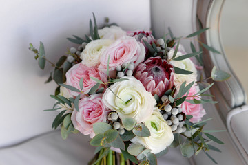 Wall Mural - Wedding flowers, bridal bouquet closeup. Decoration made of roses, peonies and decorative plants, close-up, selective focus, nobody, objects