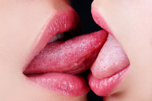 Sexy Tongue In Lesbian Girl Mouth. Homosexual Concept. French Kiss. Sensual Kiss In Same-sex Couple Close Up. Homosexual Family.