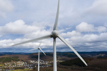 wind wheels in front a winter landscape