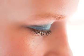 Young attractive teenager girl doing make-up