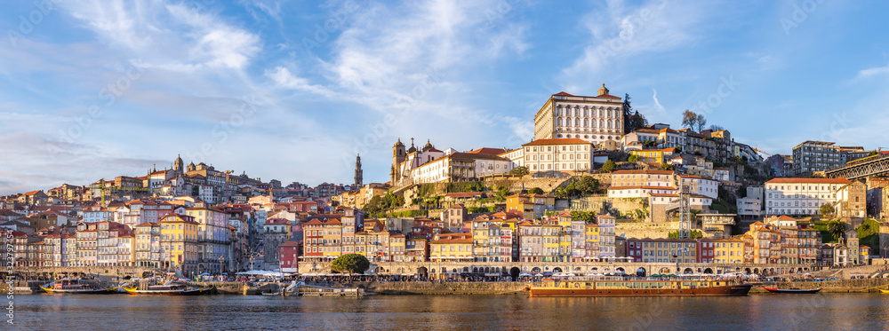 Porto in Portugal and its beautiful tourist part of Gaia and picturesque historical architecture of ancient Europe. Colorful buildings of the Portuguese city - obrazy, fototapety, plakaty 