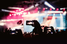 Hand With A Smartphone Shooting Live Music Festival, Concert.