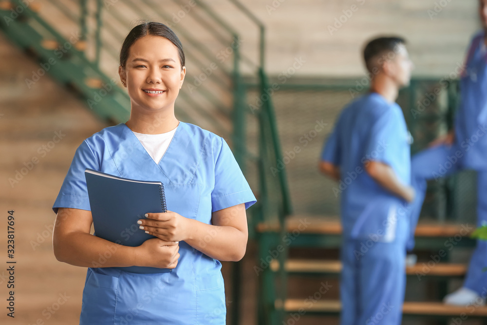 Female Asian medical student in clinic