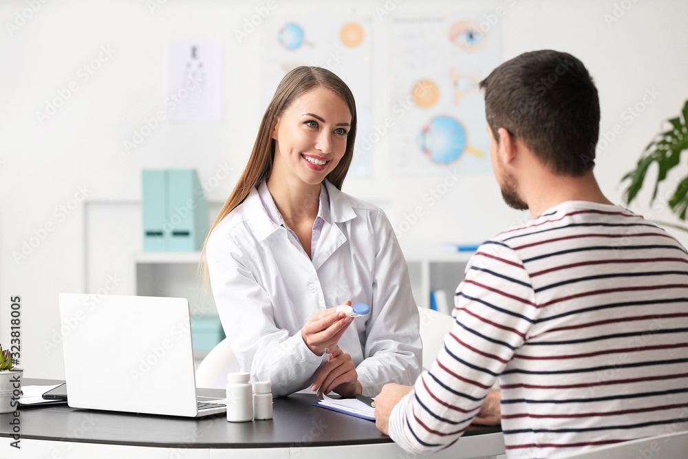 Ophthalmologist explaining patient how to use contact lenses