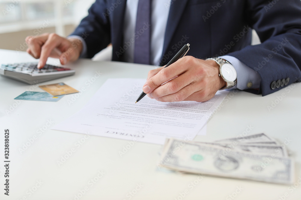 Male bank manager working in office