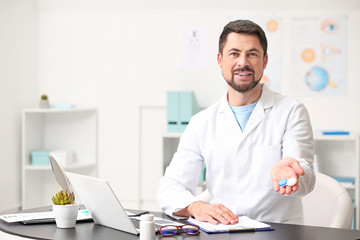 Wall Mural - Ophthalmologist with contact lenses in clinic