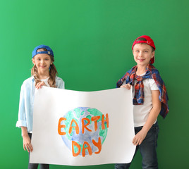 Wall Mural - Little children with drawing on color background. Earth Day celebration