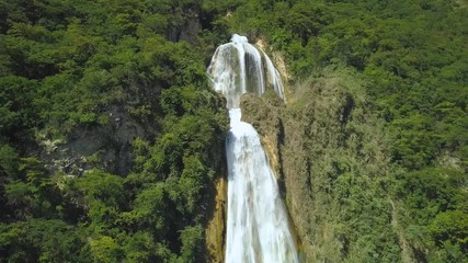 Wall Mural - Aerial view to epic waterfall in the jungle